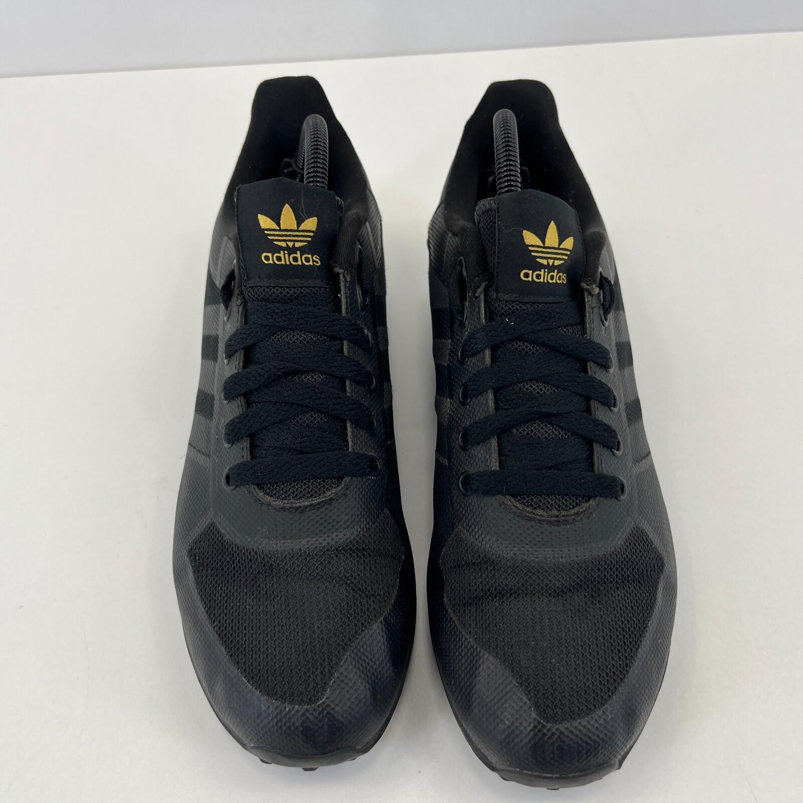 Adidas LA Trainer II Trainers in Black & Gold UK 7 / EU 40 2/3